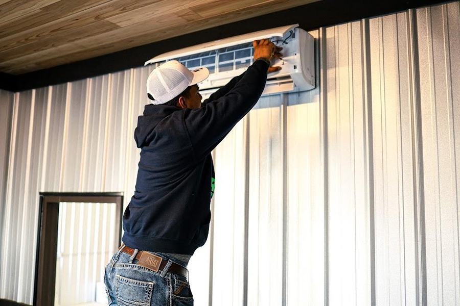 Rise technician mounting a ductless mini split