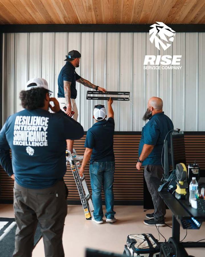 Rise team gathered in the shop