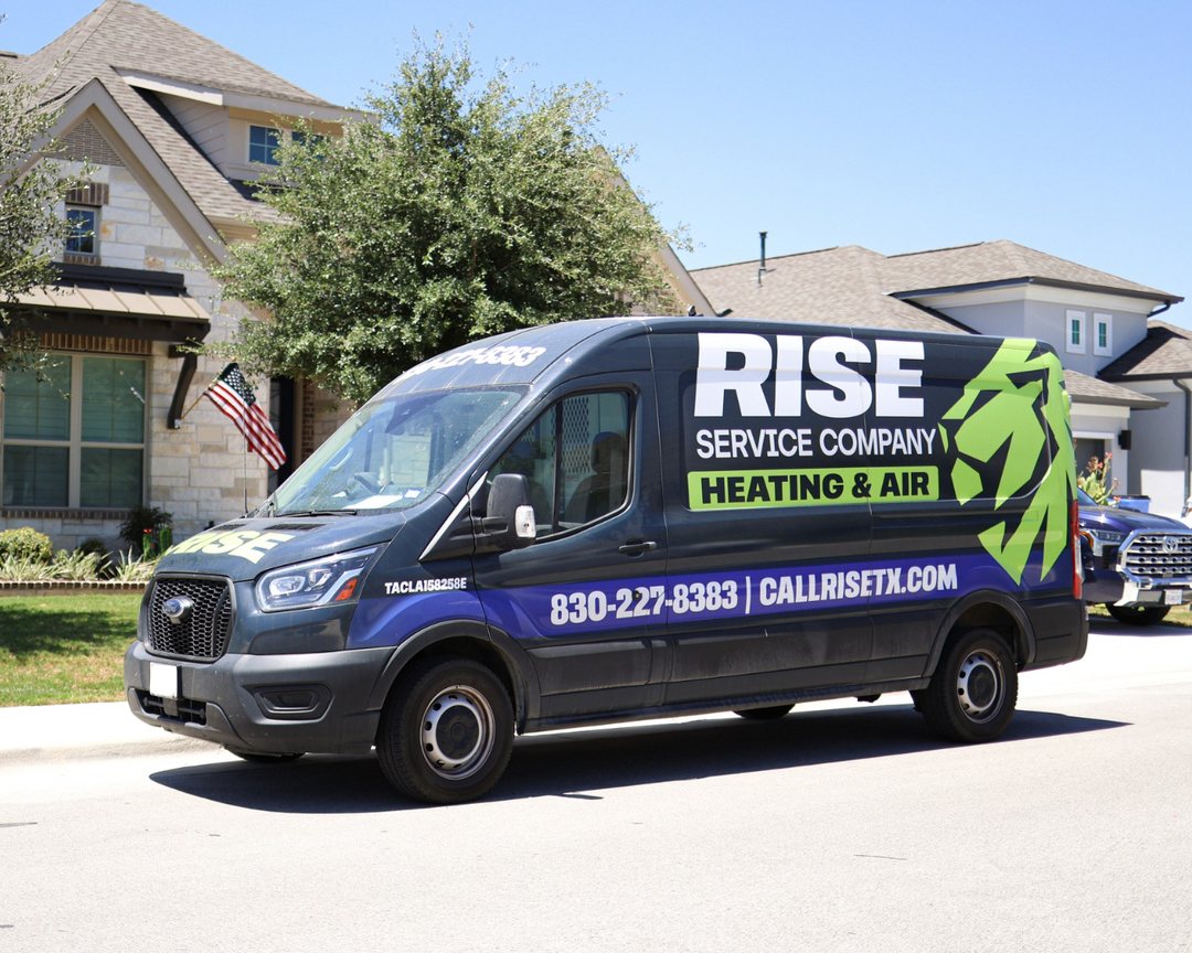 Rise Service Company van parked outside a home on a service call